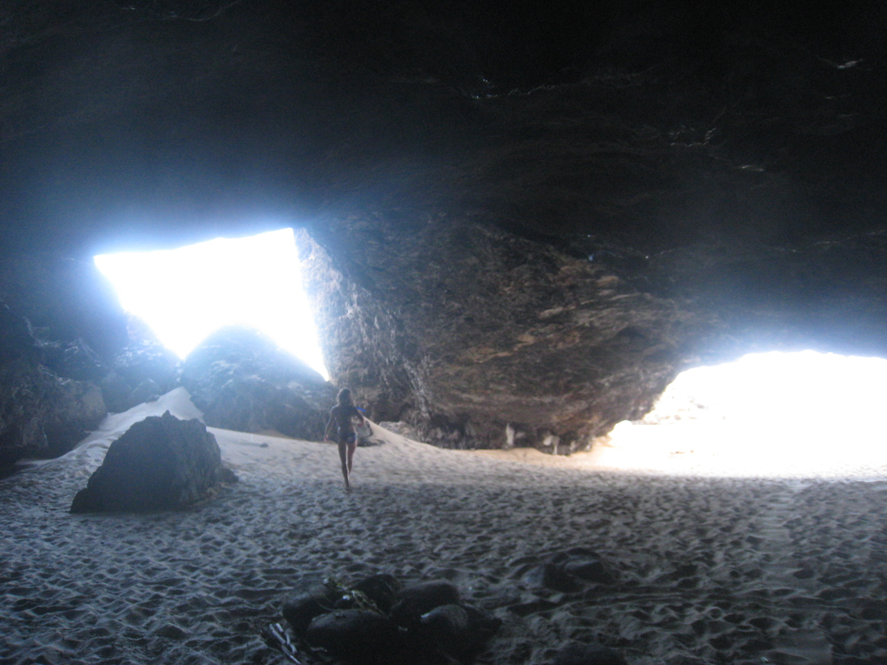 Kalalau cave trail camp beach sea napali coast kauai hawaii woman hippie